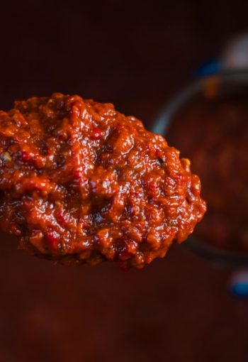 Putting,A,Spoon,Full,Of,Lyutenitsa,In,A,Jar.,Traditional