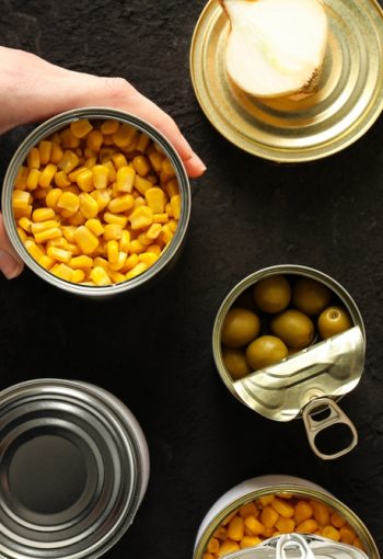 Cans,With,Food,,On,A,Dark,Background.
